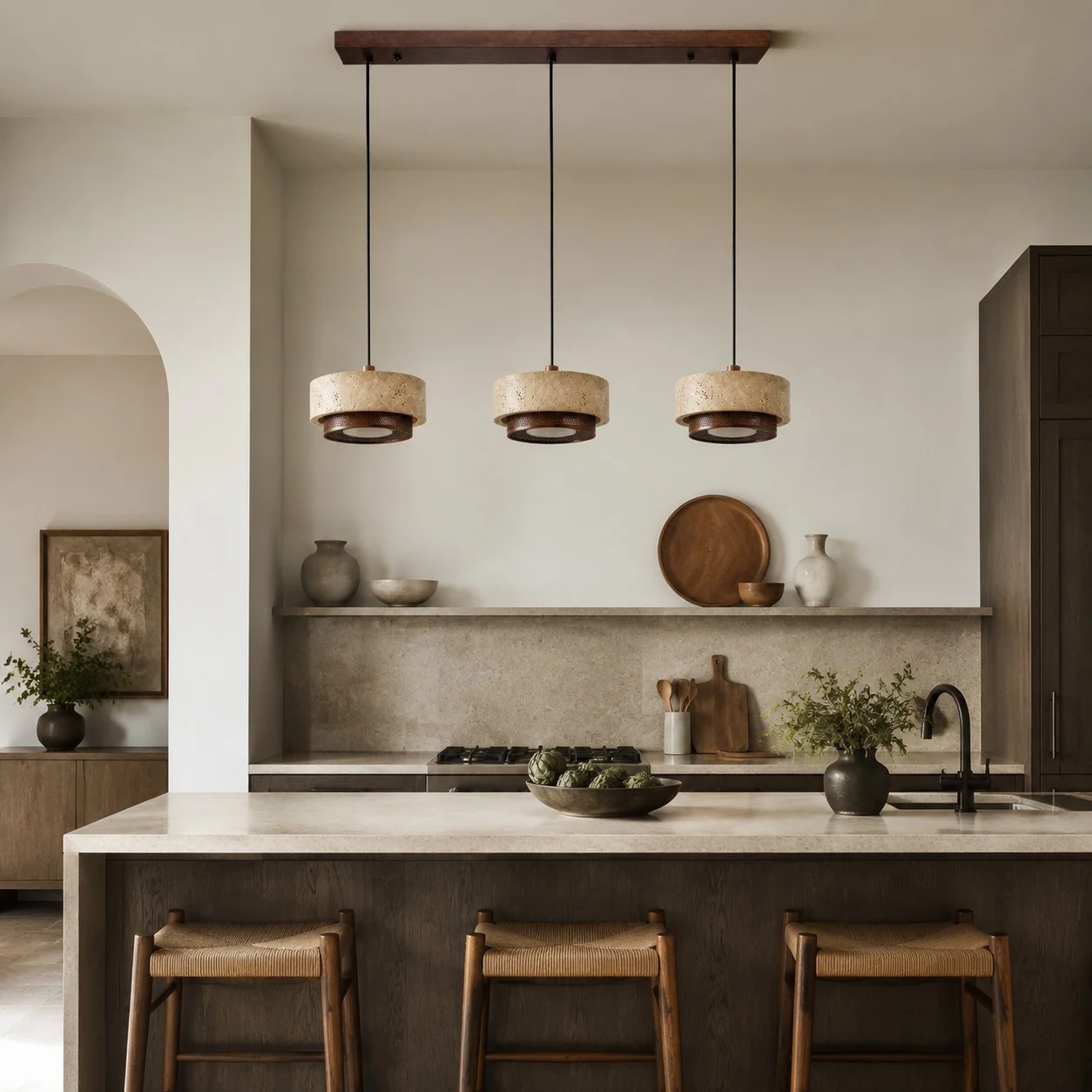 three head travertine pendant light over a kitchen island