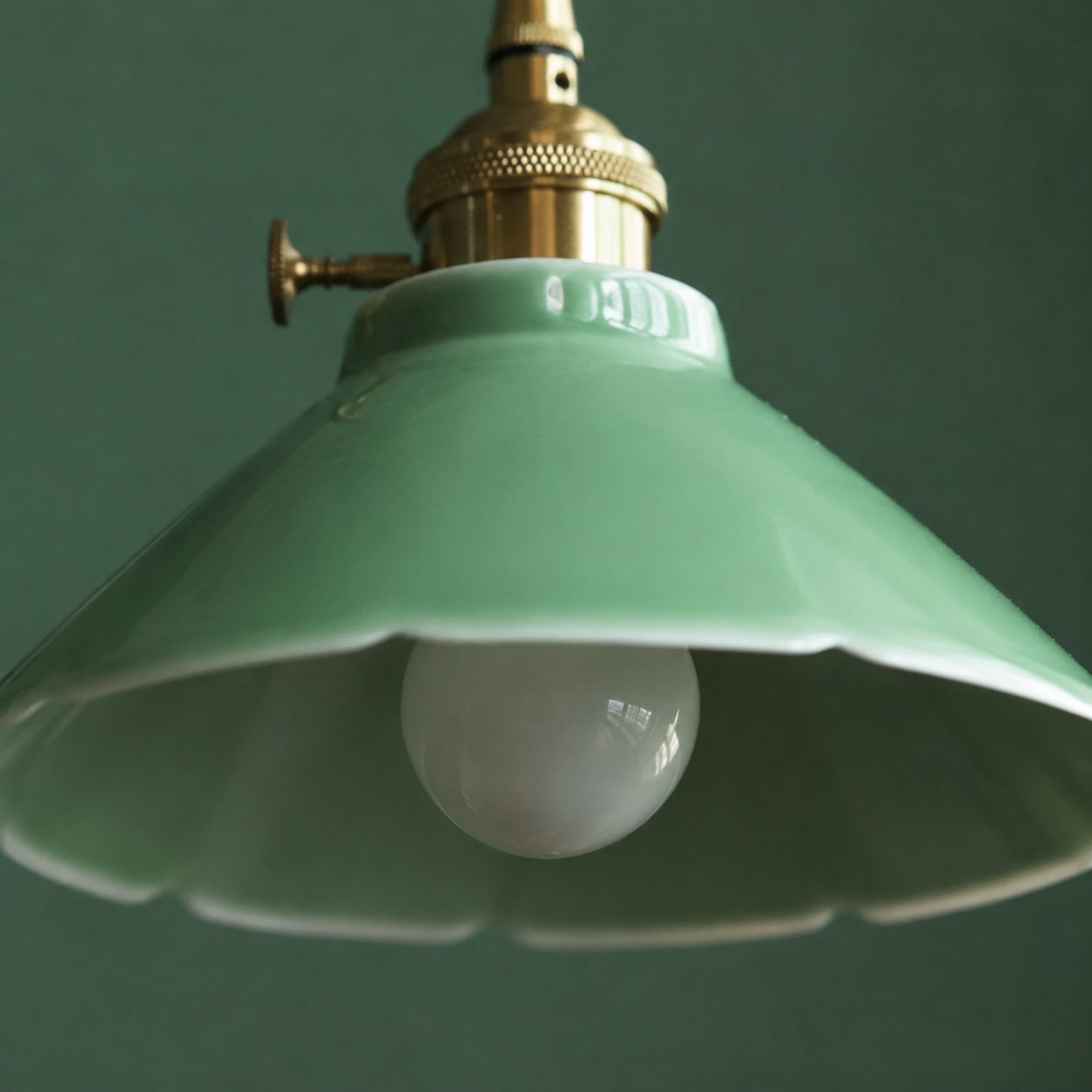 Green ceramic shade and bulb opening detail