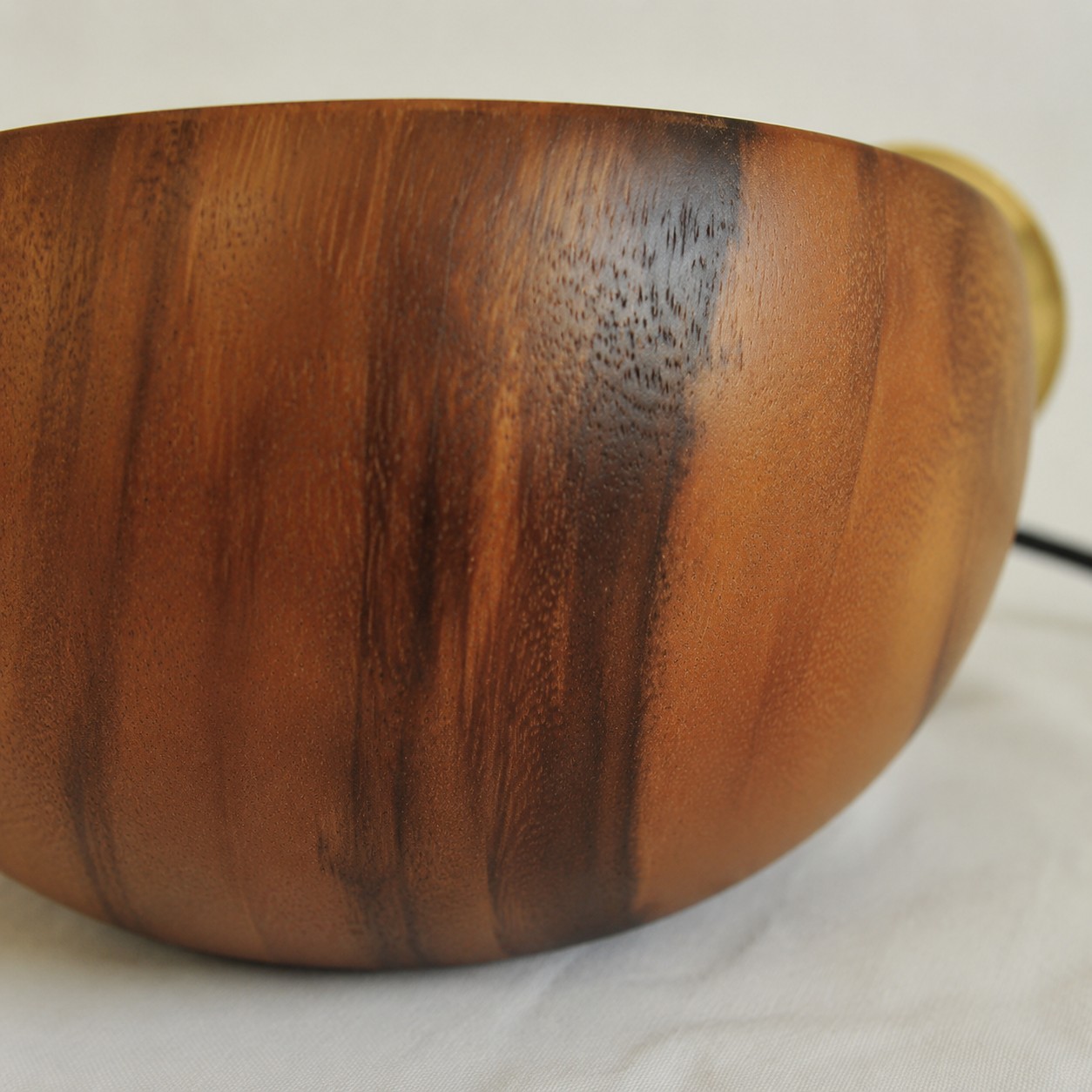 Close-up of walnut dome exterior grain and edge