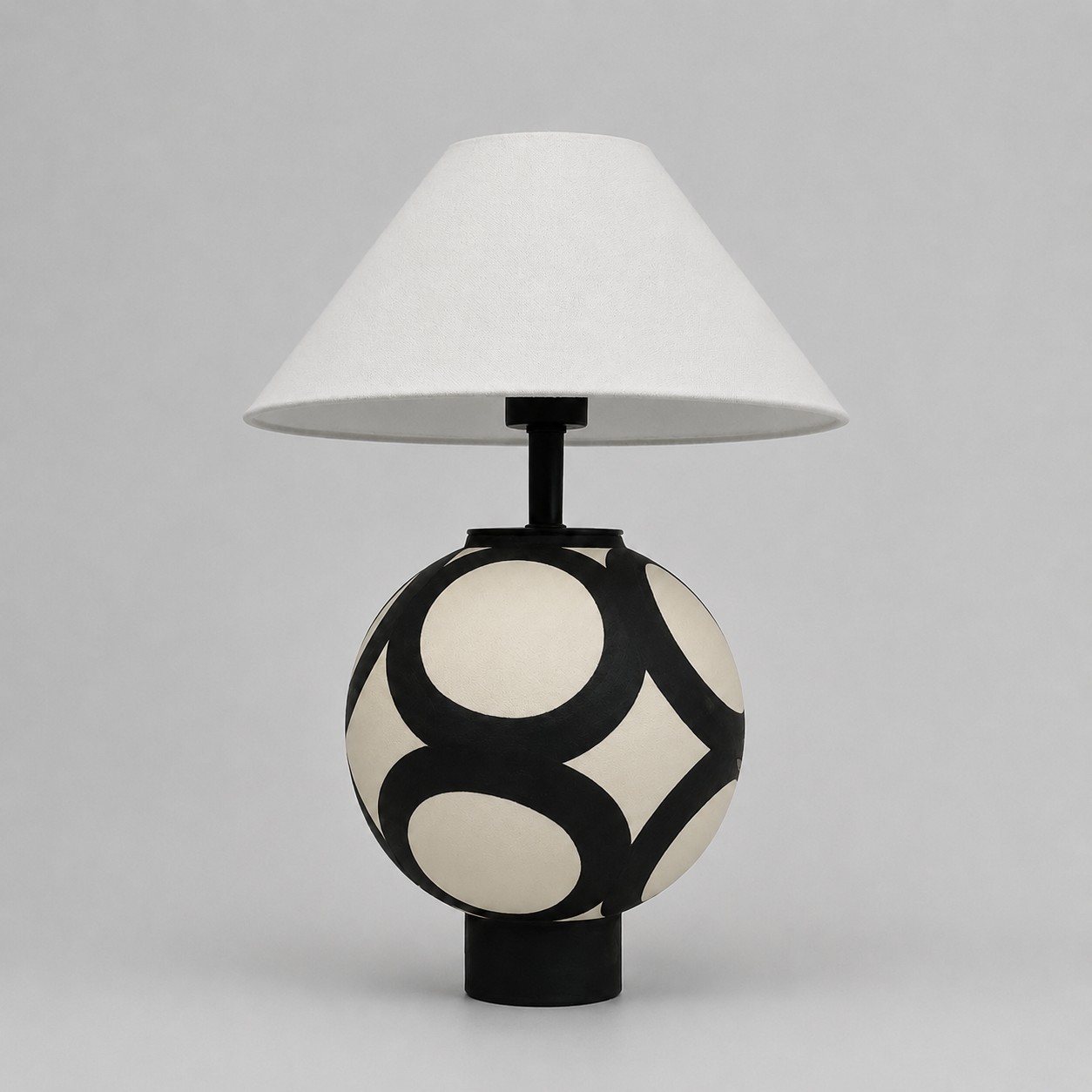 black and ivory ceramic globe table lamp with white fabric shade