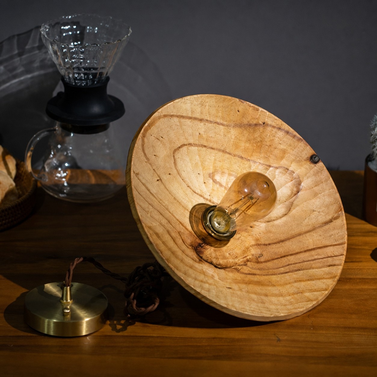 Close view of hand-carved wooden pendant shade texture