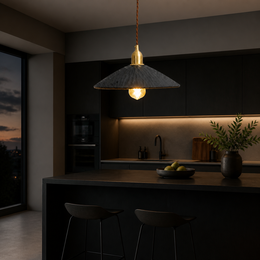 Black hand-carved wooden pendant light above kitchen island