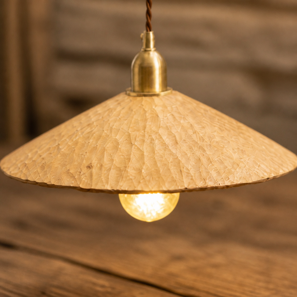 Faceted wooden pendant shade with warm light close-up